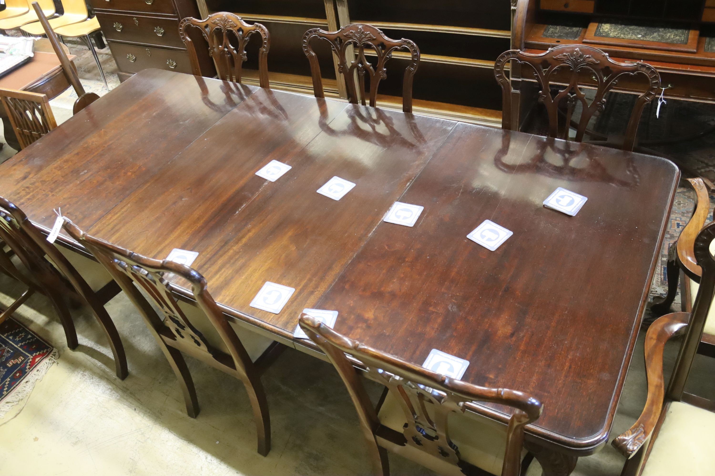 A set of eight George III style mahogany dining chairs with ball and claw feet together with a similar mahogany extending dining table, length 240cm extended (two spare leaves), width 106cm, height 74cm